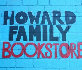 Mural on exterior wall at Howard Family Bookstore in Detroit. Photo ©2025 by Ryan M Place. All rights reserved. Mural reading "HOWARD FAMILY BOOKSTORE" in black and red text over a blue background.